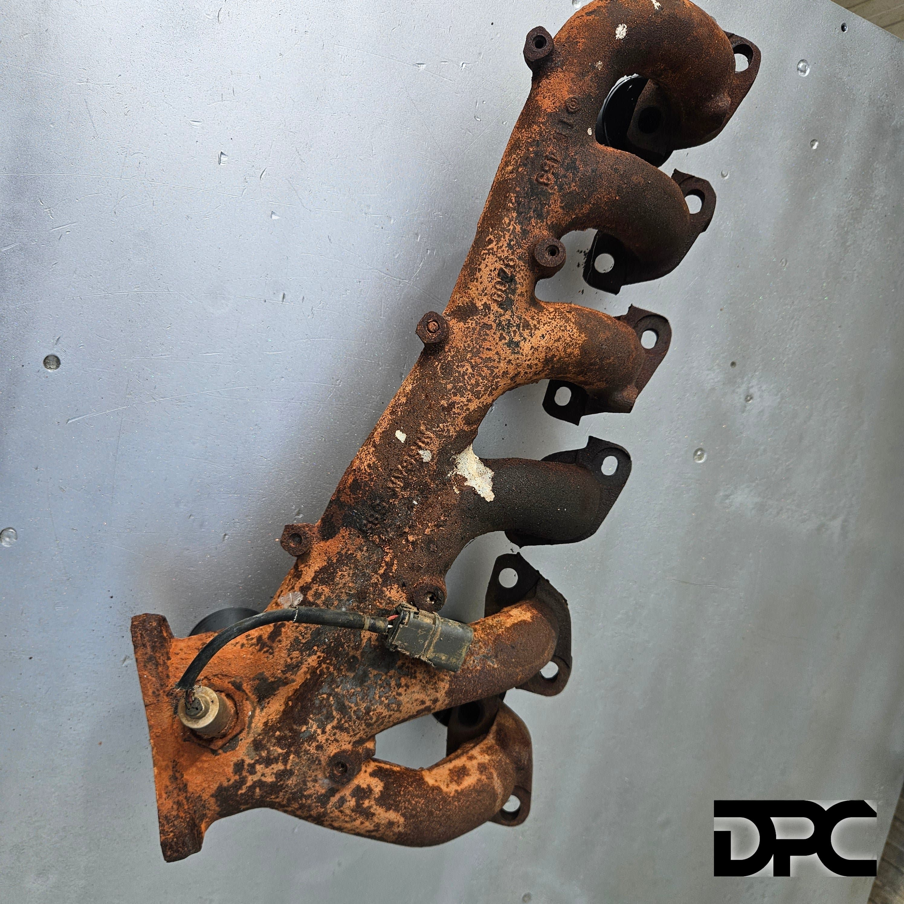 Cast Exhaust Manifold - RB25DE 14002-21U00 (Used) photo 1 of 1